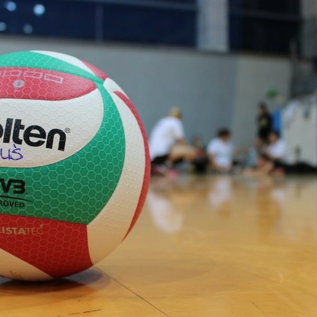 A volleyball on a gym court